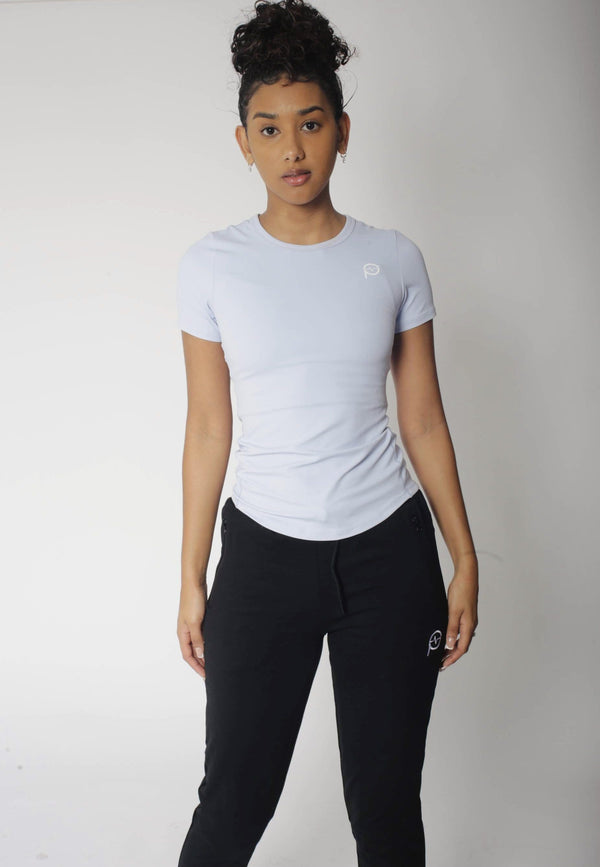 Premium Photo  A model wears a white t - shirt and black leggings with a  white t - shirt.